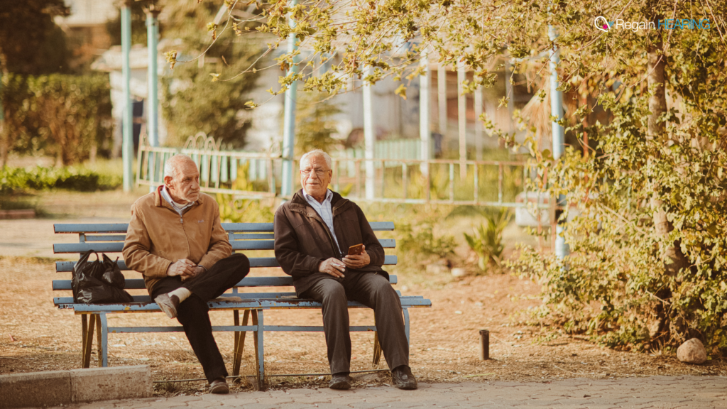 Two older gentleman on a park bench