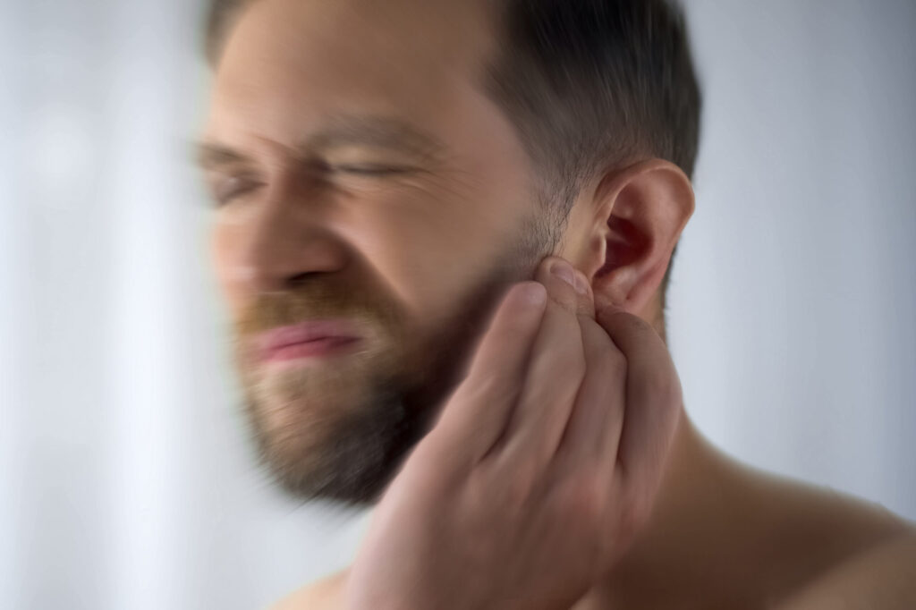 man with muffled hearing